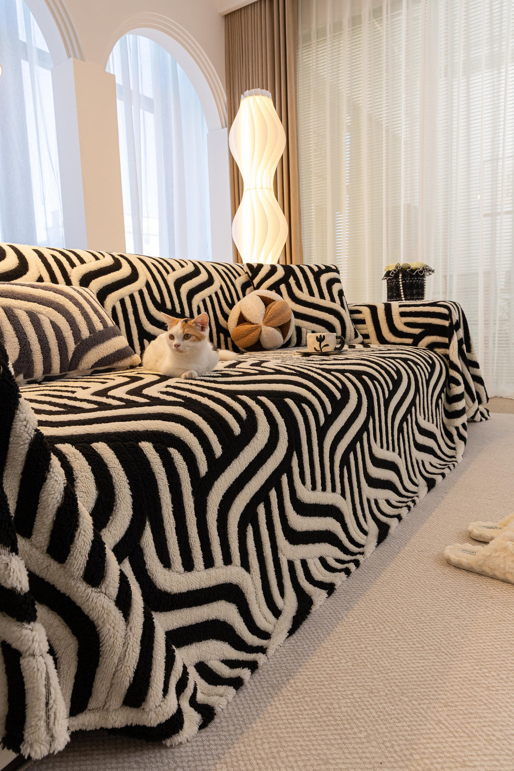 Decor Cedar Riviera Wave Stripe Sofa Cover in Black Cream - styled sofa image for plush patterned couch covers in United States