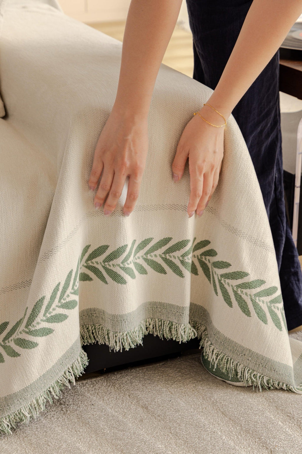 Decor Cedar Elowen Olive Border Sofa Throw Cover in Olive Border - olive border sofa throw cover hand and drape closeup in United States, image 16